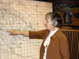 Lila Hill pointing at a historic map of Meridian